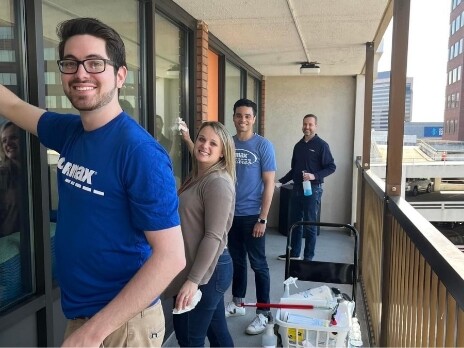 Group of Volunteers washing windows