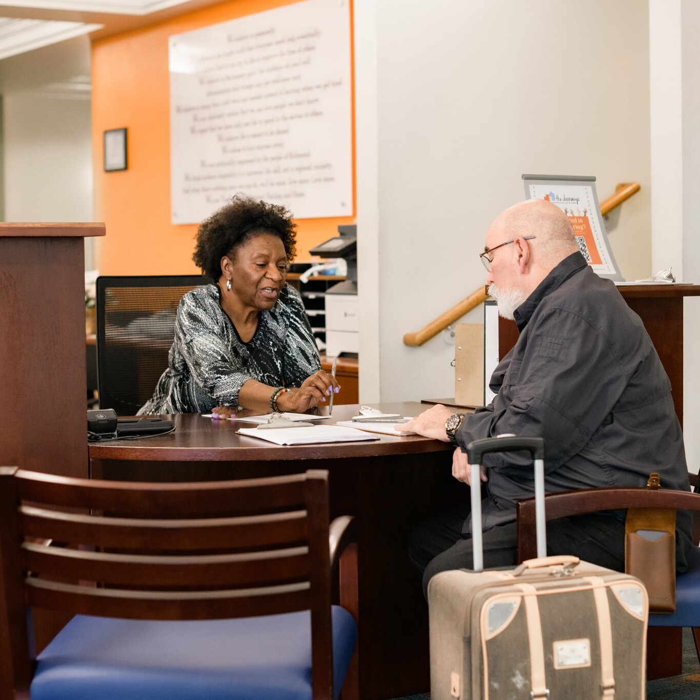 Guest Speaking with Front Desk at The Doorways