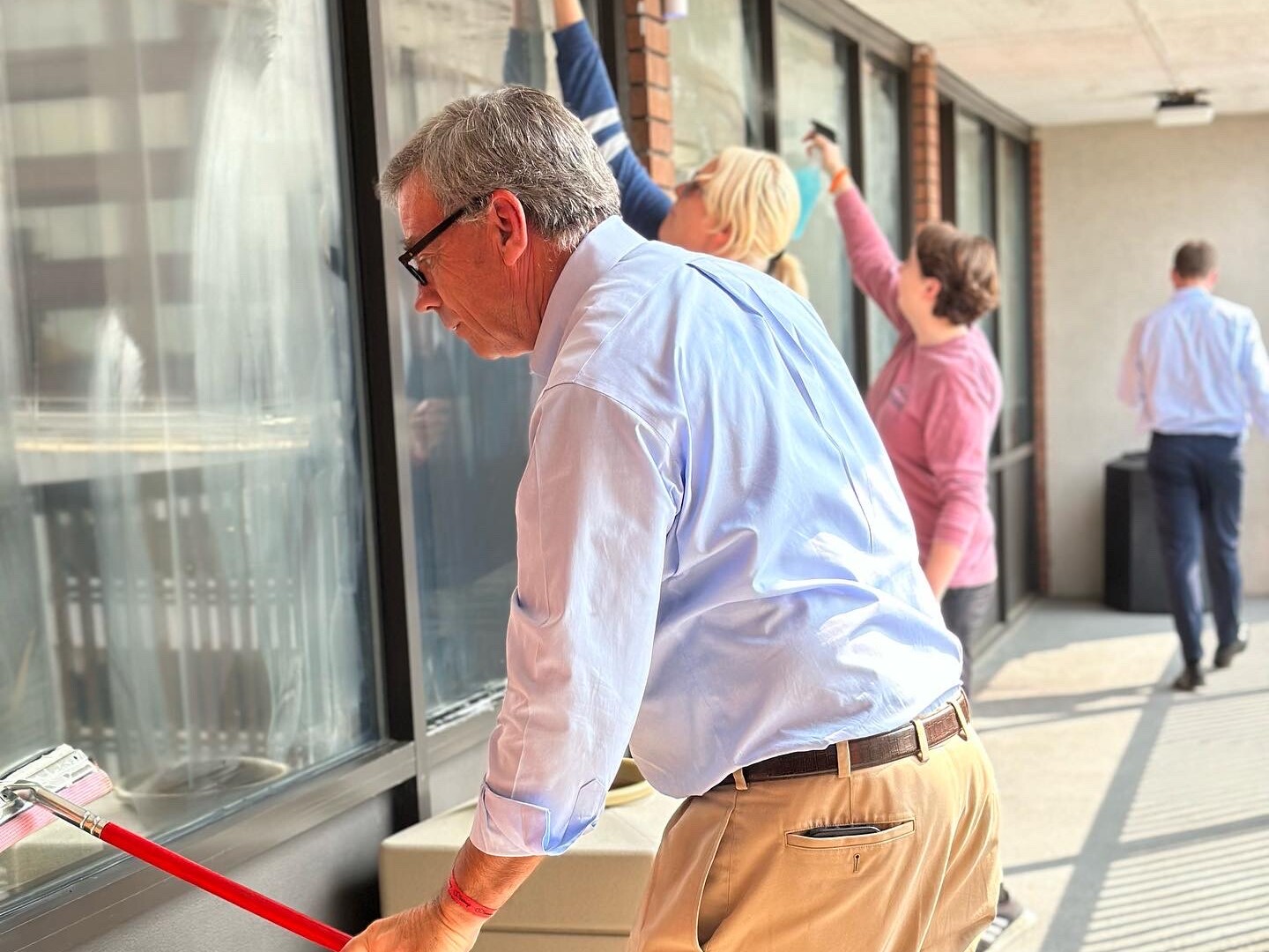 Volunteers washing windows