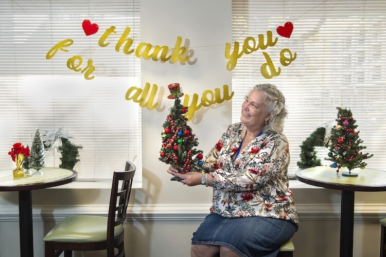 Woman holding Christmas tree