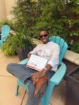 A person poses with their volunteer appreciation award
