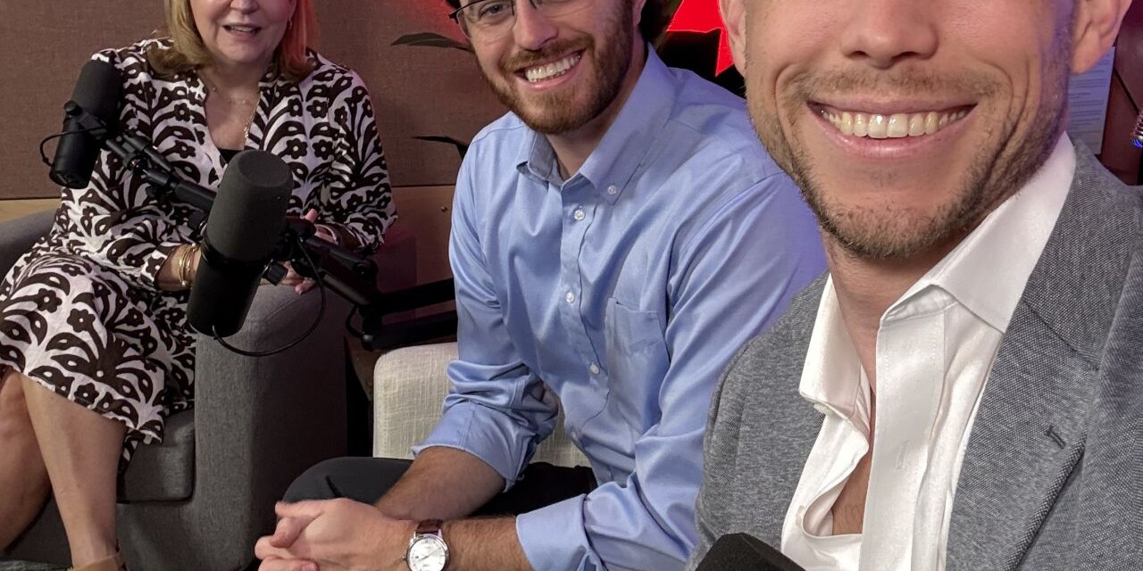 3 smiling adults sit in a podcast studio