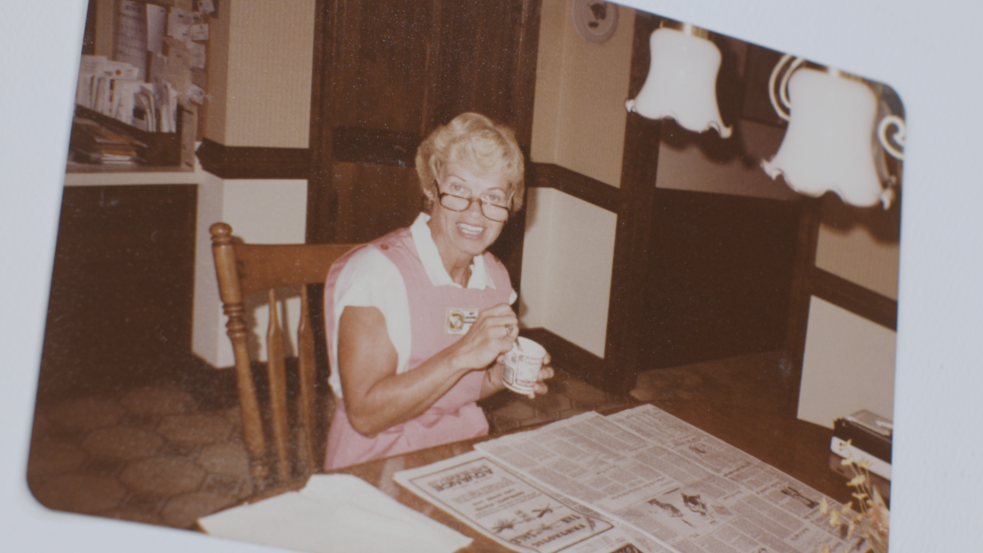 a smiling person serving the community
