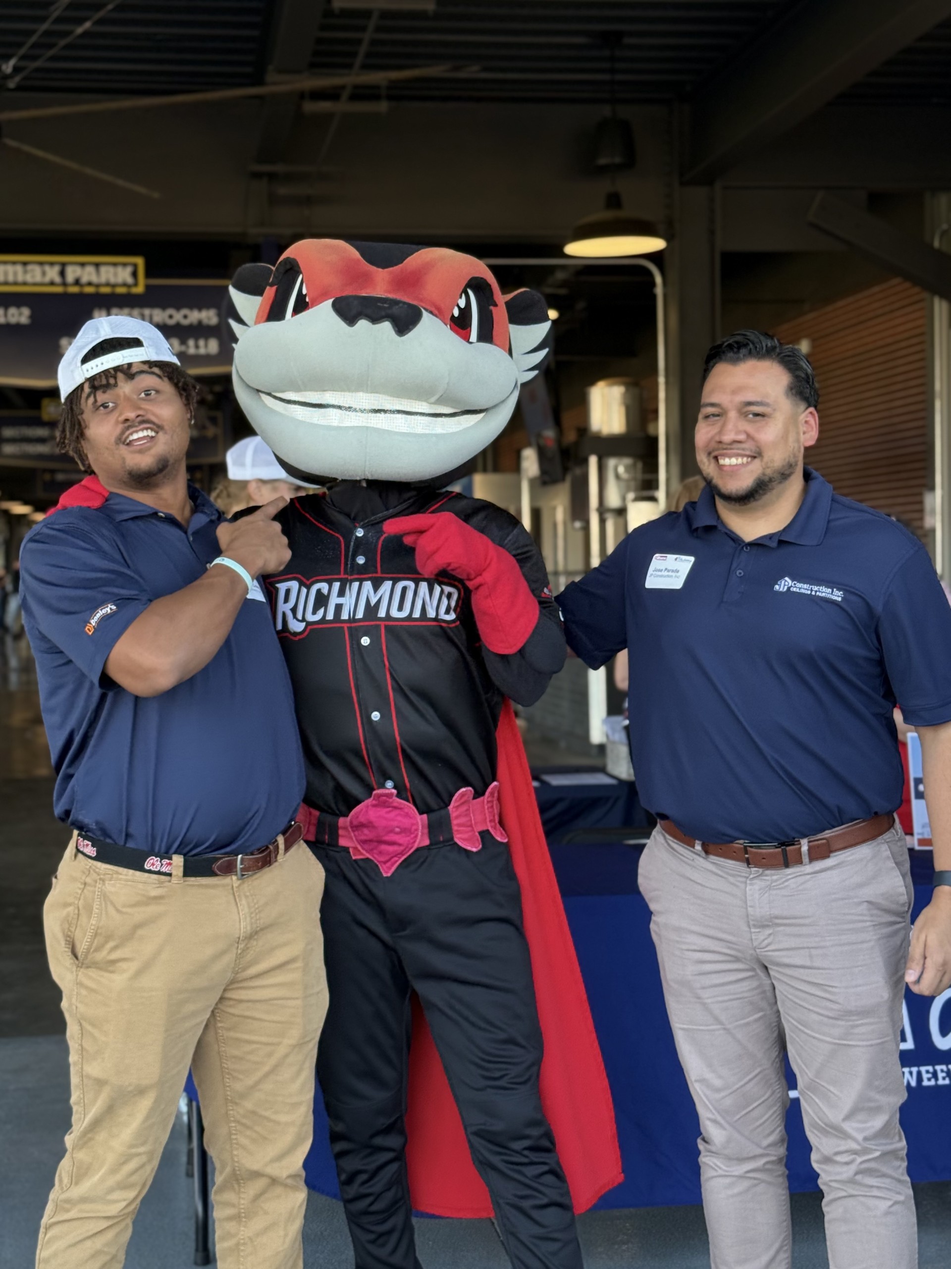 Smiling attendees at the 21st Annual Gilbane Restaurant Walk at CarMax Park pose with Nutzy