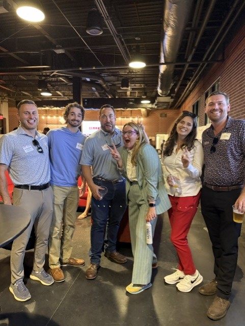 Smiling attendees at the 21st Annual Gilbane Restaurant Walk at CarMax Park