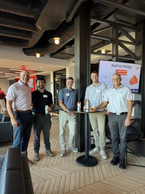 Smiling attendees at the 21st Annual Gilbane Restaurant Walk at CarMax Park