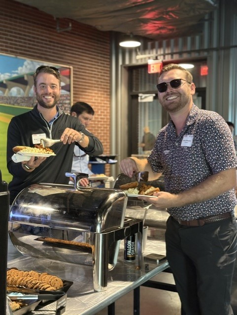 Smiling attendees at the 21st Annual Gilbane Restaurant Walk at CarMax Park