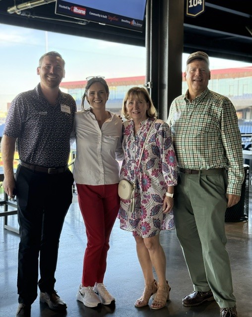 Smiling attendees at the 21st Annual Gilbane Restaurant Walk at CarMax Park