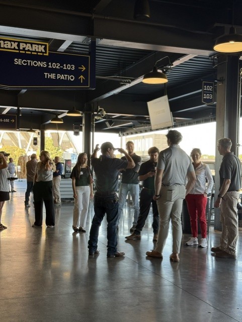 Smiling attendees at the 21st Annual Gilbane Restaurant Walk at CarMax Park