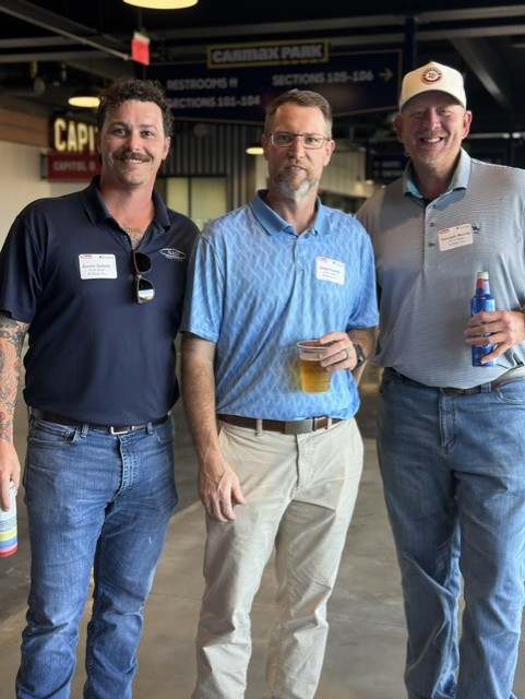 Smiling attendees at the 21st Annual Gilbane Restaurant Walk at CarMax Park