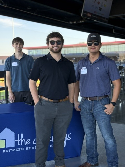 Smiling attendees at the 21st Annual Gilbane Restaurant Walk at CarMax Park