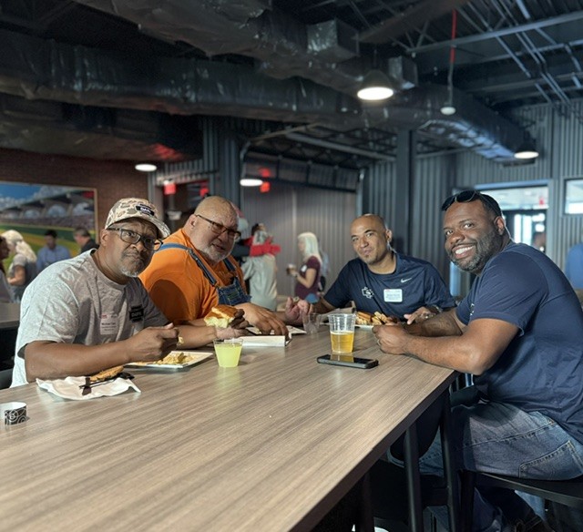 Smiling attendees at the 21st Annual Gilbane Restaurant Walk at CarMax Park