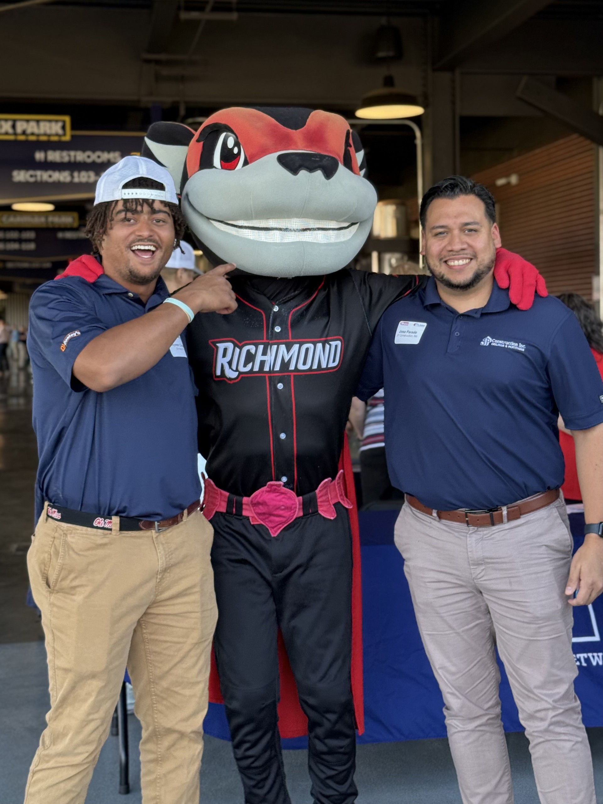 Smiling attendees at the 21st Annual Gilbane Restaurant Walk at CarMax Park pose with Nutzy