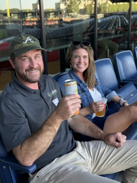 Smiling attendees at the 21st Annual Gilbane Restaurant Walk at CarMax Park