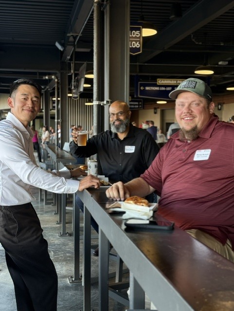 Smiling attendees at the 21st Annual Gilbane Restaurant Walk at CarMax Park