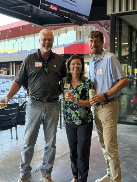 Smiling attendees at the 21st Annual Gilbane Restaurant Walk at CarMax Park