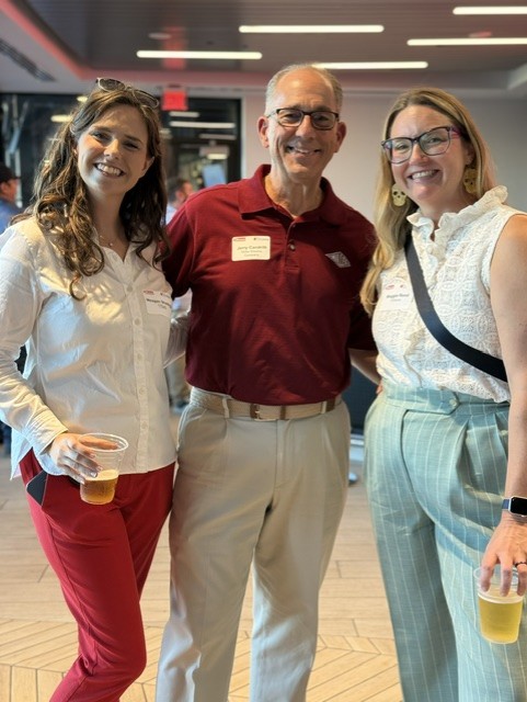 Smiling attendees at the 21st Annual Gilbane Restaurant Walk at CarMax Park