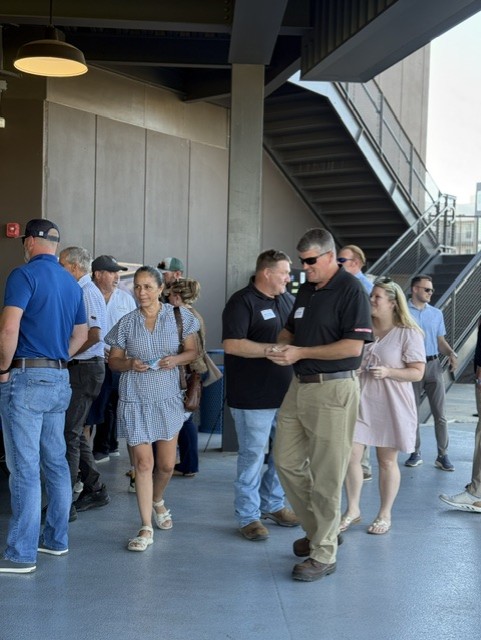 Smiling attendees at the 21st Annual Gilbane Restaurant Walk at CarMax Park