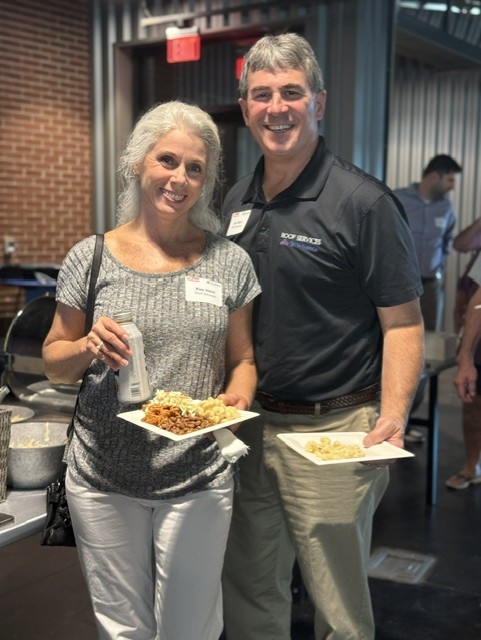 Smiling attendees at the 21st Annual Gilbane Restaurant Walk at CarMax Park