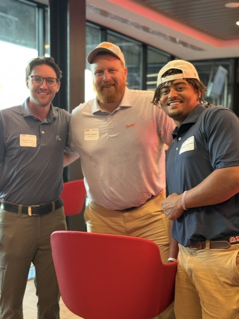 Smiling attendees at the 21st Annual Gilbane Restaurant Walk at CarMax Park