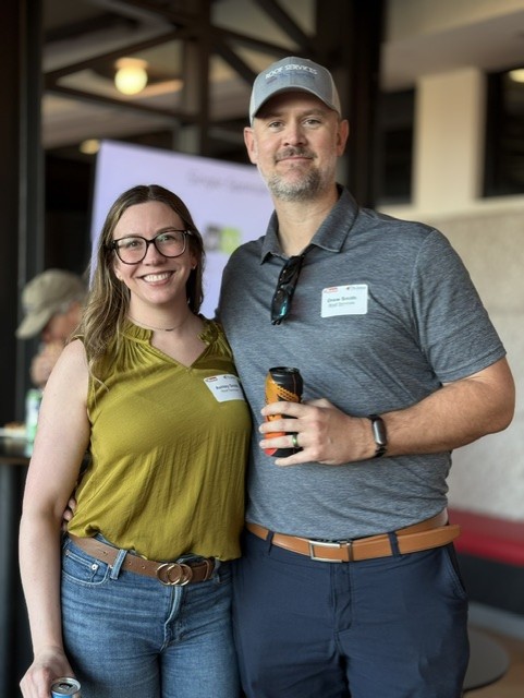 Smiling attendees at the 21st Annual Gilbane Restaurant Walk at CarMax Park